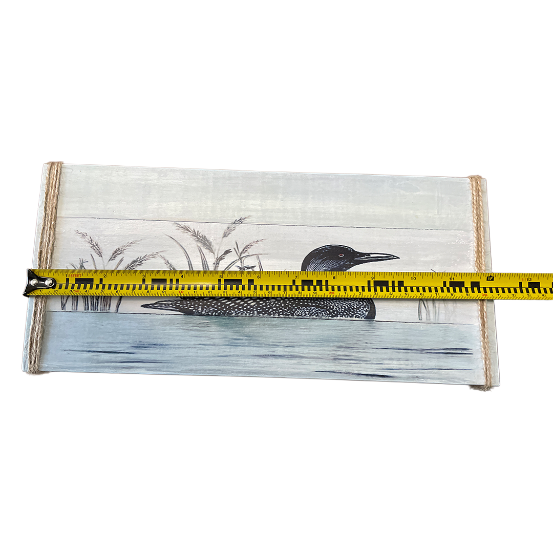 Packaged product with a duck illustration and a measuring tape for scale on a white background
